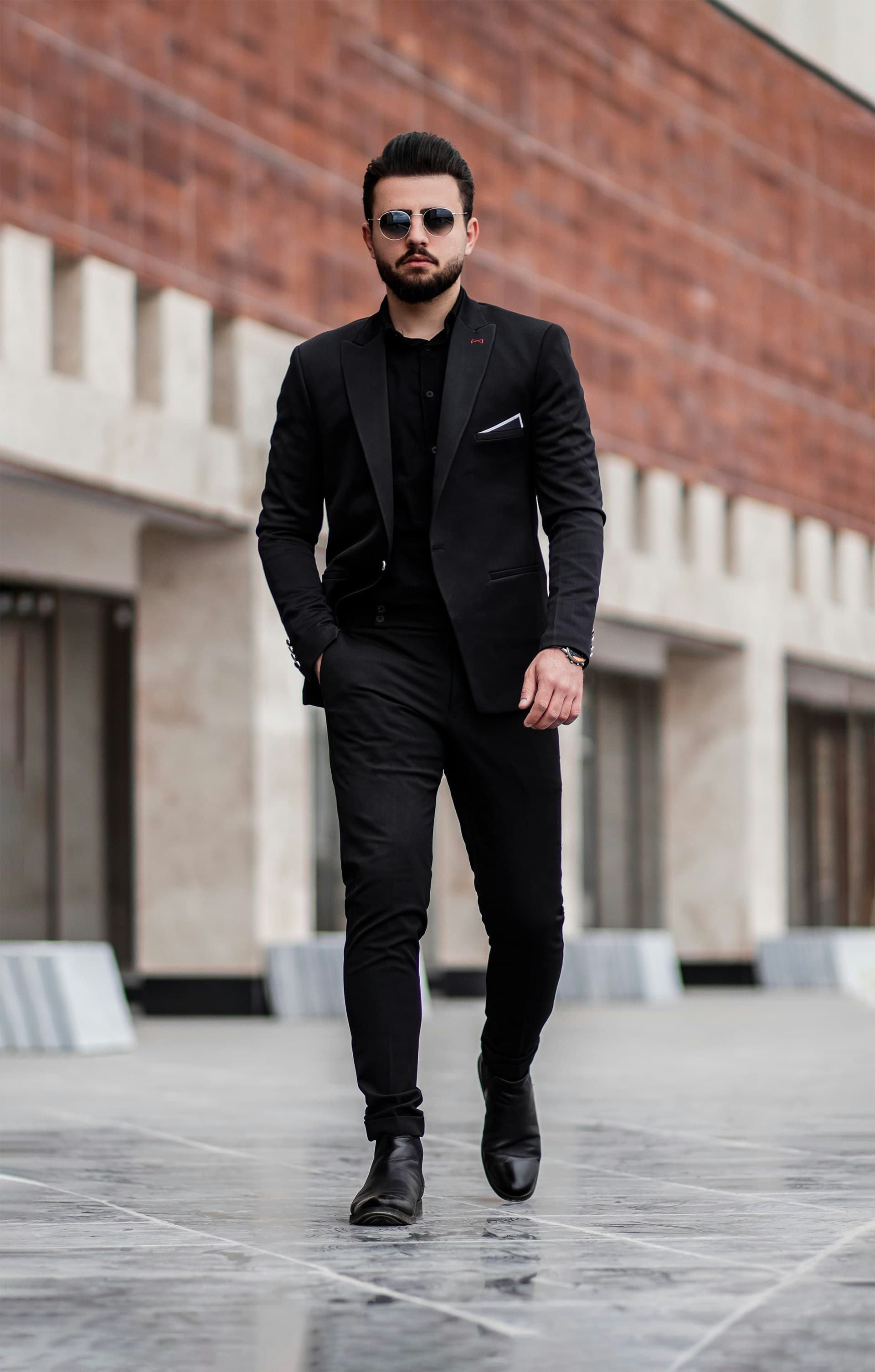 Man wearing charcoal wool formal trousers