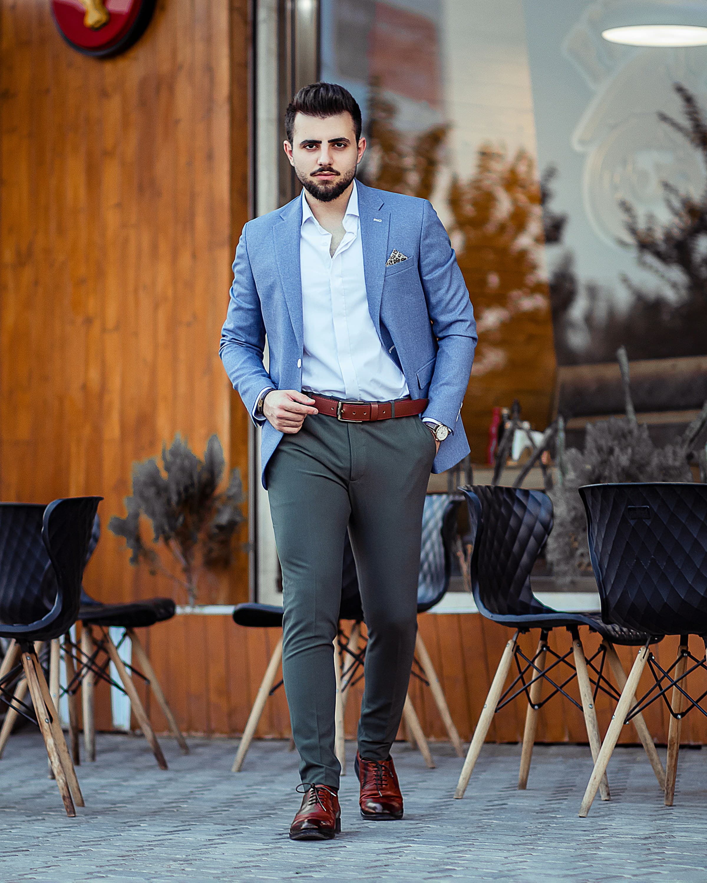 Man wearing pleated taupe trousers