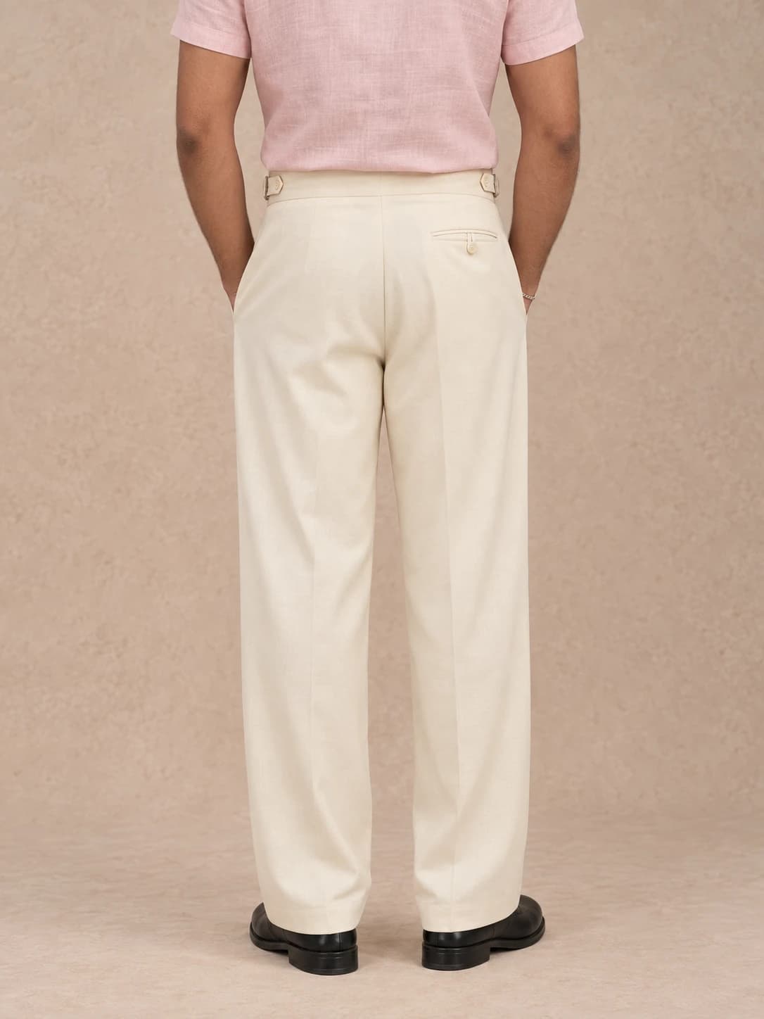 Cream pleated trousers — back view